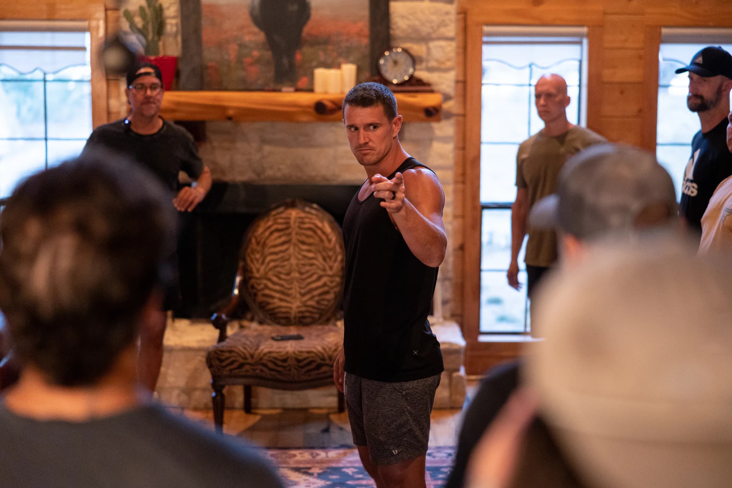 Men gathered closely during an indoor group session
